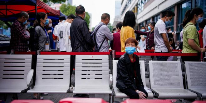 Crowds at Wuhan clinics fear coronavirus testing could rekindle disease