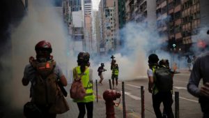 Police fire tear gas in Hong Kong as hundreds protest against proposed national security laws
