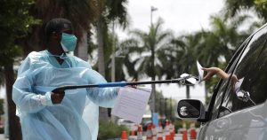 Florida sets grim coronavirus death toll record, while trailer truck outside funeral home raises COVID-19 fears